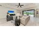 Cozy living room featuring modern decor and an open view to the pool area at 8264 Summer Night Rd, Sarasota, FL 34241