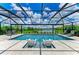 Stunning pool area with relaxing lounge chairs and picturesque lake views beyond the screened enclosure at 8264 Summer Night Rd, Sarasota, FL 34241