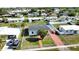 An aerial view of a cozy single-story home showcasing the property's layout within a quiet residential neighborhood at 8725 Aero Ave, North Port, FL 34287