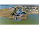 Aerial view of community lake house and dock with stunning views of the surrounding area at 909 Crosswind Ave, Sarasota, FL 34240