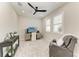 Neutral toned bedroom featuring a modern ceiling fan and view filled windows at 909 Crosswind Ave, Sarasota, FL 34240