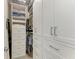 Custom closet with ample shelving, drawers, and hanging space provides plenty of storage at 909 Crosswind Ave, Sarasota, FL 34240