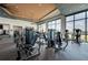 Well-equipped fitness center with modern exercise machines and large windows with stunning views at 909 Crosswind Ave, Sarasota, FL 34240