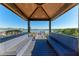 Covered seating area with serene views of the lake and access to the boat dock at 909 Crosswind Ave, Sarasota, FL 34240