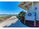 View of the lakehouse and community rules with walkway to the lake at 909 Crosswind Ave, Sarasota, FL 34240