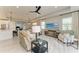 Bright living room features a comfortable seating area, ceiling fan, and an open concept layout at 909 Crosswind Ave, Sarasota, FL 34240