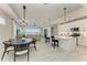 Open-concept living space showcasing modern finishes, a kitchen island, dining area, and seamless flow at 909 Crosswind Ave, Sarasota, FL 34240