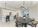 Bright, open floor plan connecting the kitchen, dining, and living areas, complete with modern finishes at 909 Crosswind Ave, Sarasota, FL 34240