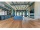 Expansive lounge area with high ceilings, wood floors, and a cozy fireplace at 909 Crosswind Ave, Sarasota, FL 34240