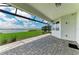 The screened patio provides seamless indoor-outdoor living with stunning water views at 909 Crosswind Ave, Sarasota, FL 34240