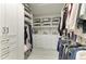 Spacious walk-in closet with custom shelving and ample storage for clothes and accessories at 909 Crosswind Ave, Sarasota, FL 34240