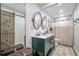 Charming bathroom featuring a double vanity, shiplap accent wall, and a sliding barn door at 946 N Beneva Rd # V26, Sarasota, FL 34232