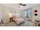 Cozy bedroom with natural light, neutral tones, and ample space at 946 N Beneva Rd # V26, Sarasota, FL 34232