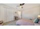 Bright bedroom features a ceiling fan, closet, and ample space at 946 N Beneva Rd # V26, Sarasota, FL 34232