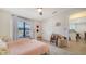 Bedroom features a ceiling fan, closet, and ample space at 946 N Beneva Rd # V26, Sarasota, FL 34232