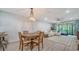 Elegant dining area with a stylish chandelier, seamlessly connected to the living room at 946 N Beneva Rd # V26, Sarasota, FL 34232