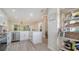 Modern kitchen with stainless steel appliances and an open layout to the living area at 946 N Beneva Rd # V26, Sarasota, FL 34232