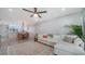 Bright and open living room featuring a comfortable sofa and modern decor at 946 N Beneva Rd # V26, Sarasota, FL 34232