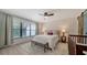 Sunlit main bedroom features a ceiling fan, and ample space at 946 N Beneva Rd # V26, Sarasota, FL 34232