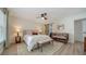 Serene main bedroom with a ceiling fan, barn door, and inviting ambiance at 946 N Beneva Rd # V26, Sarasota, FL 34232