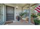 Cozy front porch with a comfortable chair and a welcoming entrance at 946 N Beneva Rd # V26, Sarasota, FL 34232