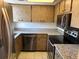 Functional kitchen with speckled countertops, stainless steel appliances, and updated hardware at 10800 N Us Highway 19 # 237, Pinellas Park, FL 33782