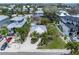 Charming neighborhood aerial view featuring lush tropical landscaping, palm trees, and well-maintained properties at 109 Maple Ave, Anna Maria, FL 34216