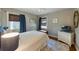 Well-lit bedroom showcasing a comfortable bed, ample natural light, and charming coastal decor at 109 Maple Ave, Anna Maria, FL 34216