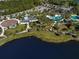 Community amenities view includes the pool, playground, and lakes, creating a relaxing and active lifestyle at 12682 Shimmering Oak Cir, Venice, FL 34293
