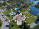 Aerial view showcases the community playground, common area, and resort-style pool at 12682 Shimmering Oak Cir, Venice, FL 34293
