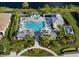 Aerial view of the community pool with a hot tub, gazebo and lounge area at 12682 Shimmering Oak Cir, Venice, FL 34293