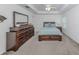 Bedroom featuring dark wood furniture and carpeted floors, with neutral walls and plenty of natural light at 12682 Shimmering Oak Cir, Venice, FL 34293