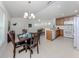 Open concept view of the kitchen and dining room with stainless steel appliances at 12682 Shimmering Oak Cir, Venice, FL 34293