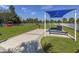 Well maintained community dog park with play equipment, shaded seating, and lush grass at 12682 Shimmering Oak Cir, Venice, FL 34293