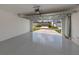 Spacious garage with a freshly painted floor and an open view of the driveway and street at 12682 Shimmering Oak Cir, Venice, FL 34293