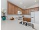 Bright kitchen with white countertops and stainless steel appliances at 12682 Shimmering Oak Cir, Venice, FL 34293