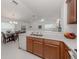 Bright open-concept kitchen and dining area with plenty of counter space at 12682 Shimmering Oak Cir, Venice, FL 34293
