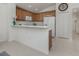 Kitchen with breakfast bar next to dining room at 12682 Shimmering Oak Cir, Venice, FL 34293