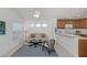 Bright living room with a comfortable sofa, modern decor, and an open view to the kitchen area at 12682 Shimmering Oak Cir, Venice, FL 34293