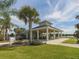 Community pavilion with picnic tables, lush landscaping, and a beautiful view on a sunny day at 12682 Shimmering Oak Cir, Venice, FL 34293