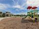Bright and colorful community playground with a slide and other play equipment for  at 12682 Shimmering Oak Cir, Venice, FL 34293