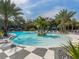 Inviting community pool with lush landscaping, offering a tranquil tropical escape at 12682 Shimmering Oak Cir, Venice, FL 34293