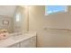 Elegant powder room featuring a vanity with marble countertop, undermount sink, and chrome fixtures at 12708 Aquamarine Ave, Bradenton, FL 34211