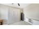 Stylish bedroom with a large built-in wardrobe and modern decor, perfect for organized living at 12708 Aquamarine Ave, Bradenton, FL 34211