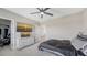 Serene bedroom with a ceiling fan, TV, and closet, offering a comfortable and relaxing retreat at 12708 Aquamarine Ave, Bradenton, FL 34211