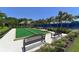 Outdoor bocce ball court with benches and lush landscaping in a well-maintained community at 12708 Aquamarine Ave, Bradenton, FL 34211