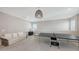 Spacious bonus room featuring a ping pong table and a comfortable seating area perfect for entertaining guests at 12708 Aquamarine Ave, Bradenton, FL 34211