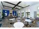 Spacious clubhouse with multiple seating areas, a fireplace, and large windows for natural light at 12708 Aquamarine Ave, Bradenton, FL 34211