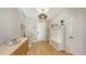 Welcoming foyer with stylish decor, a functional bench, and ample storage space at 12708 Aquamarine Ave, Bradenton, FL 34211