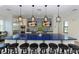 Modern community kitchen with blue countertops, stainless steel appliances, and barstool seating at 12708 Aquamarine Ave, Bradenton, FL 34211